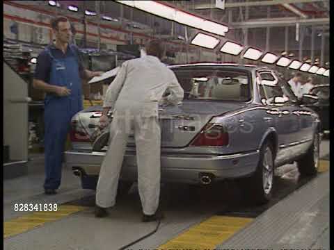 , title : 'Jaguar X300s on the production line 1995'