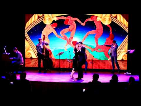  Magdalena Gutierrez  and  German Ballejo  are  dancing  to  a  tango