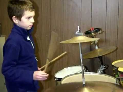 Young Los Straitjackets fan on drums