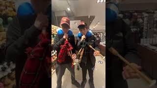 Professional bagpipe players go in middle of store (gone wrong at 3am)