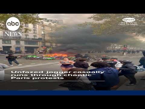 Unfazed jogger casually runs through chaotic Paris protests