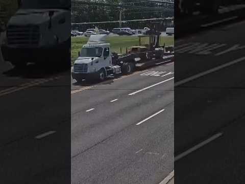 Semitruck hauling a forklift sends a utility pole flying