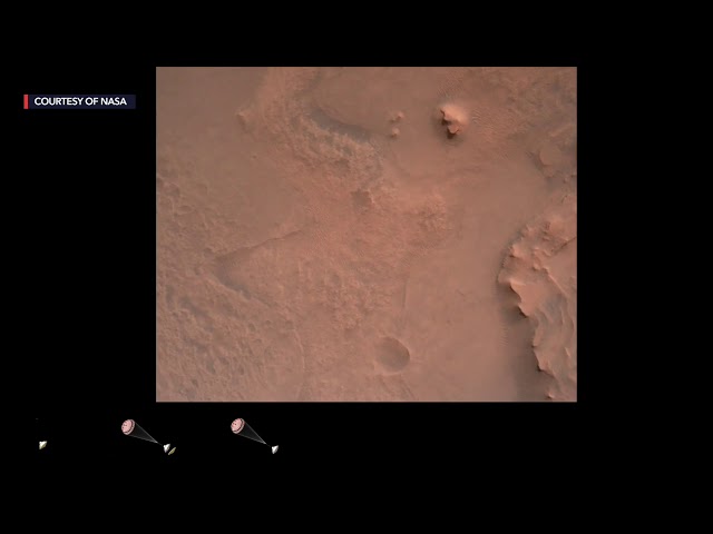 Mars rover sends home movie of daredevil descent to landing on red planet