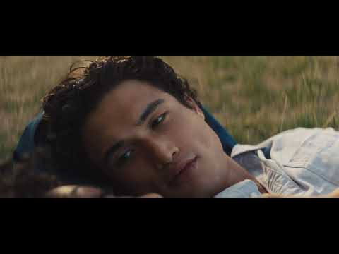 Trailer frame of the couple riding the Roosevelt Island tram above the East River