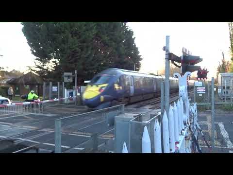 Train at Sturry Level Crossing Canterbury Kent England, infamous for long delays & pollution levels