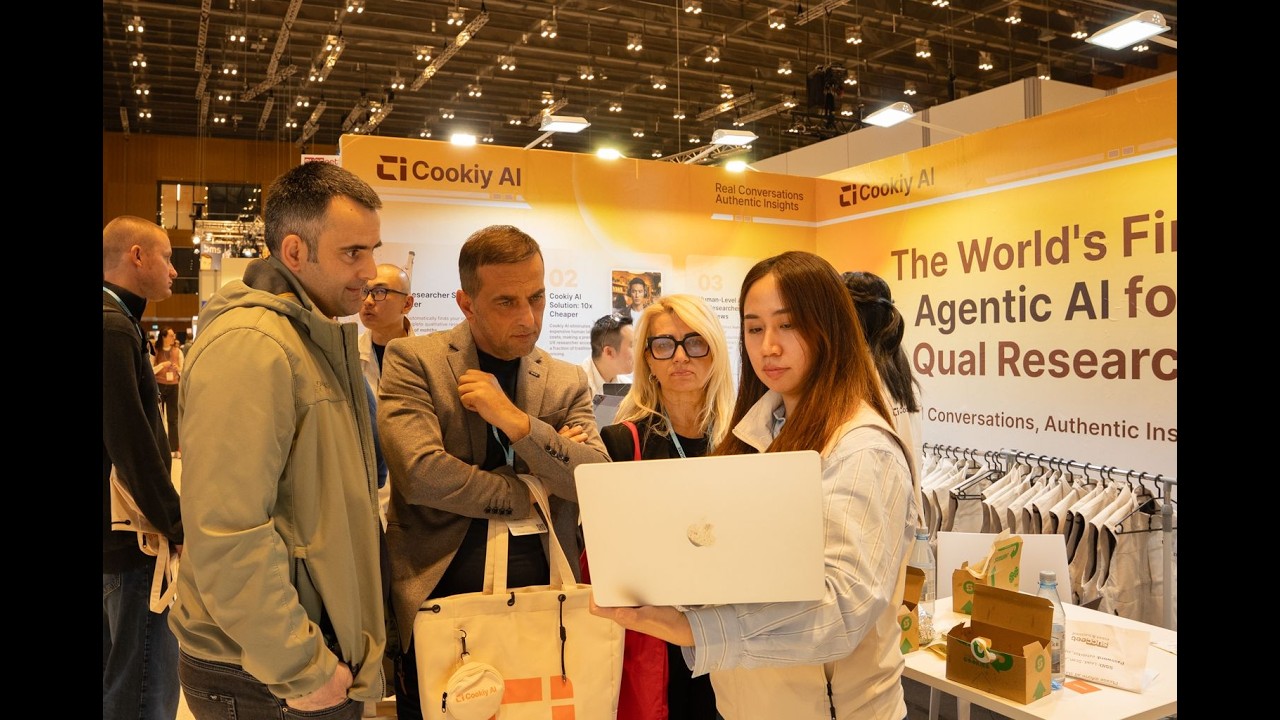 Cookiy AI presenting at SUCCEET26 in Wiesbaden, Germany — a crowd gathered at the Cookiy booth to see live AI-led qualitative research