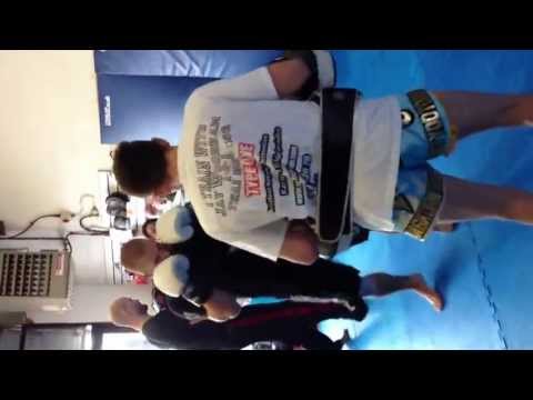 Reece Thomson holding pads at masters martial arts seminar