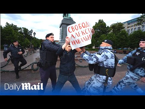 Russian police forcefully detain activists supporting Putin foe Navalny in Moscow