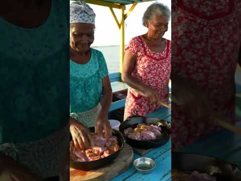Haitian Grandmas with Dog Cooking Griot on a Boat” #grandmacooks