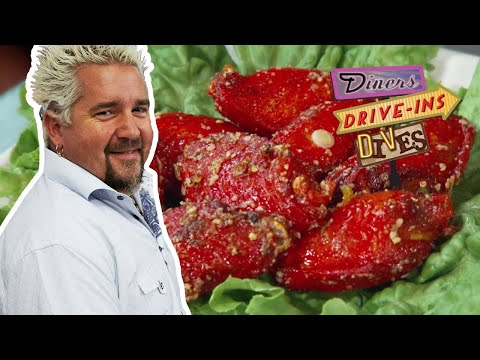 SCREAMING Red Spicy Garlic Wings | Diners, Drive-ins and Dives with Guy Fieri | Food Network