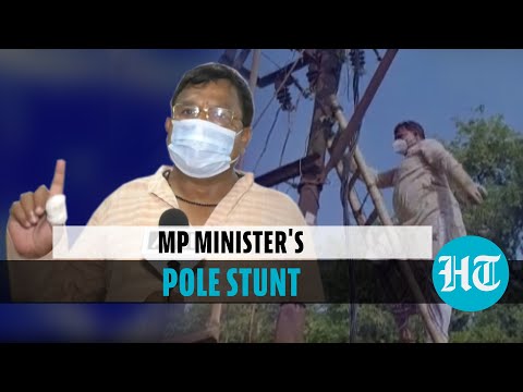 MP energy minister climbs electric pole to clean it, blames dust for power cuts | Hindustan Times
