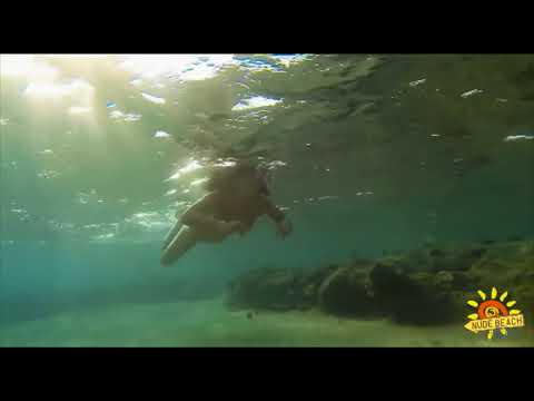 Girl swims underwater in fins and snorkel (Девушка плавает под водой в ластах и маске с трубкой)