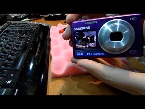 Ремонт фотокамеры Samsung DV150F. Заклинил объектив. Чистка объектива от песка.