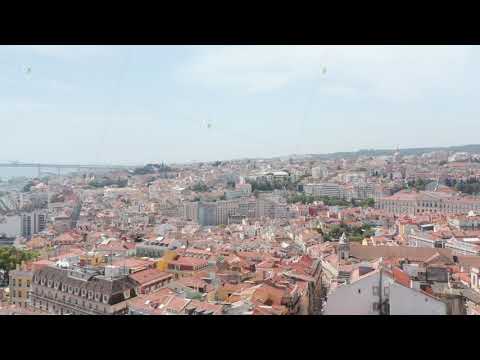 Aerial view of various buildings in downtown. Drone flying over red roofs. Lisbon, capital of
