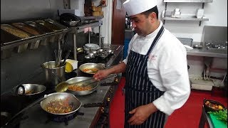 Busy Chef at Work: Action Inside an Indian Restaurant Kitchen at Bradford Zouk Tea Bar & Grill, U.K.