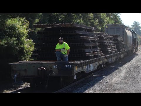 Mass Coastal Railroad MC-4 with rail train on Ex-DODX Military Flatcars