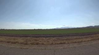preview picture of video 'Passenger View on AZ 85 Highway north to Buckeye, AZ for goPro battery swap, 3 August 2014, GP060074'