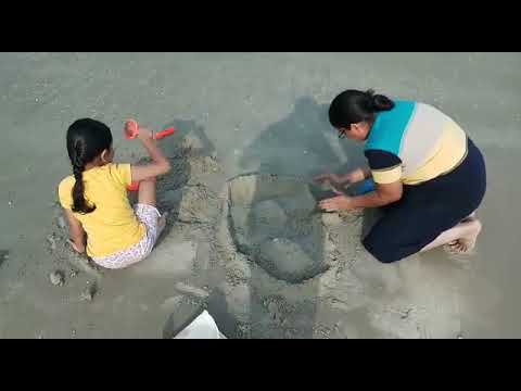 Building a sand castle at Varca beach, Goa- May 2018