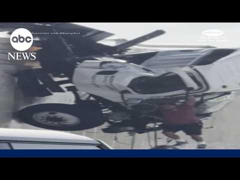 Driver escapes truck dangling over San Diego highway