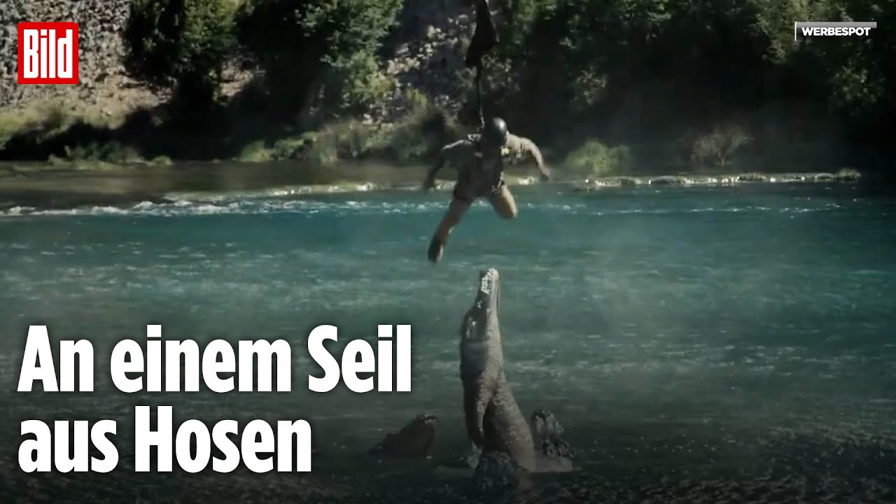 Mann baumelt über Alligator-Fluss