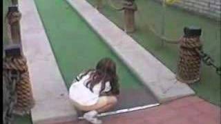 Sheri cheats in mini-golf