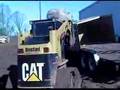 Skid steer with pallet forks unloads a heavy load in SC
