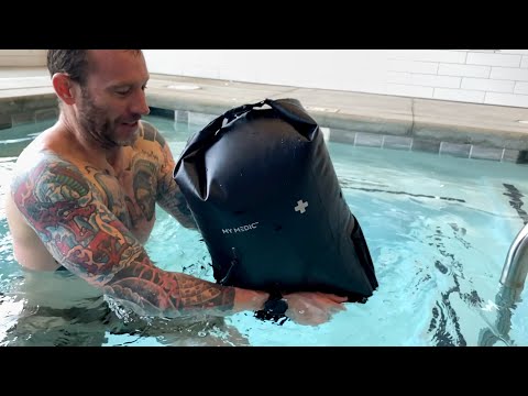 Part of a video titled How To Use A Dry Bag As A Floatation Device - YouTube