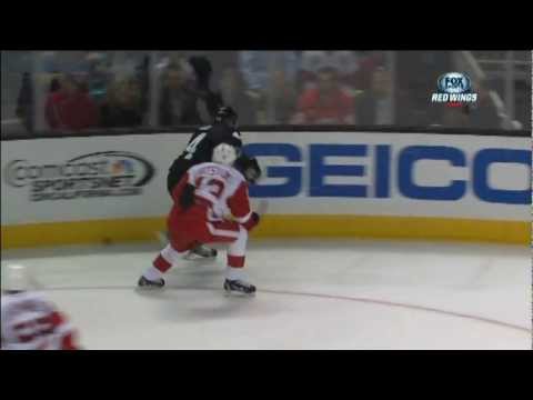 Pavel uses Brendan Smith's stick to knock the puck out of the air and clear the zone