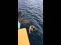 Slo motion of boy jumping off the pirate ship plank ...