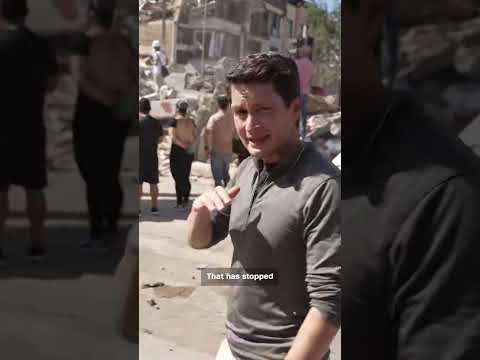 Rescue teams scramble to free people trapped in rubble