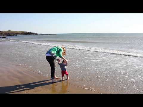 Ella's first dip in the sea - Aberffraw Beach