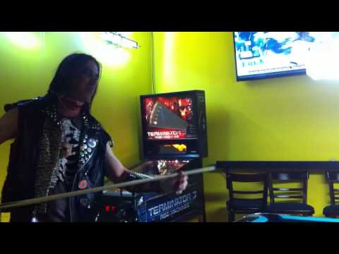 Eyesore front man Metalhead drinking beer and shooting pool.