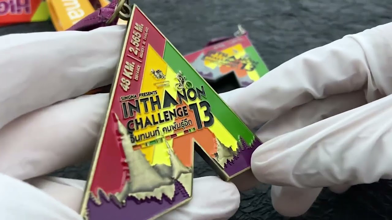 1084 - Bicycle INTHANON Challenge Triangle Embossed and Enamel Medal