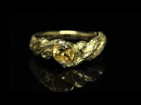 Interlacing — ring made of  yellow gold with citrine 