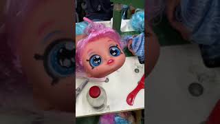 Workers sew the hair into doll heads and style it!