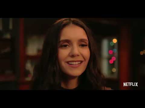 Love Hard closing trailer shot with snow and Christmas lights over the couple