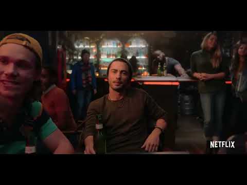 Love Hard Netflix trailer frame with Nina Dobrev walking through holiday lights