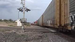 preview picture of video 'Union Pacific Railroad trains meet at Mescal, Arizona under thundering skies'