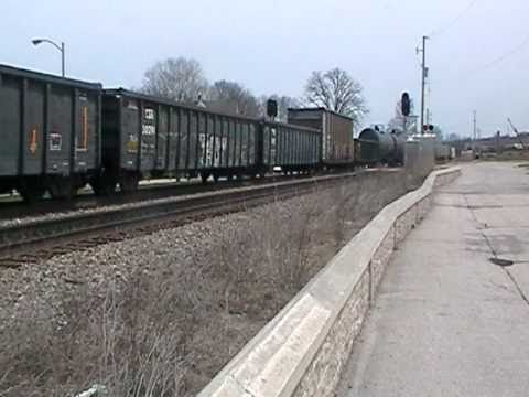 CP 9777 LEADS TRAIN 299 WEST THRU WAUWATOSA BY HART PARK 4-24-11.MOD