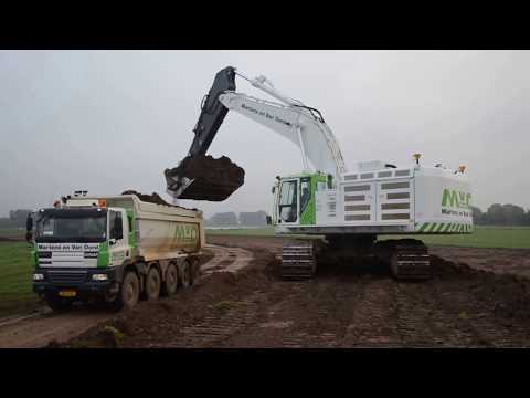Big Cat 374F Excavator with Skilled Operator Loading Dumptruck FAST