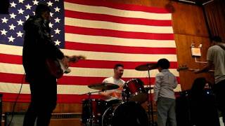 Geoffrey drumming with The So So Glos