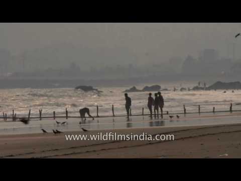 People frolic at Waltair Beach in Visakhapatnam