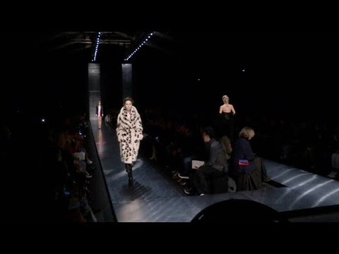 Models and designer on the runway for the Ermanno Scervino Fashion Show