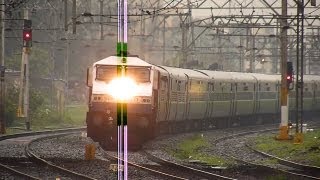 preview picture of video 'Elegant Machine WDP-4 accelerates hard with the 22 coach Udyan Express in rains!!'