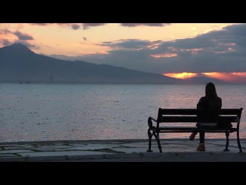 Woman Sitting On Beach Bench  Stock Video