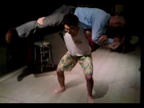 Steven Nicola Squats Business Man