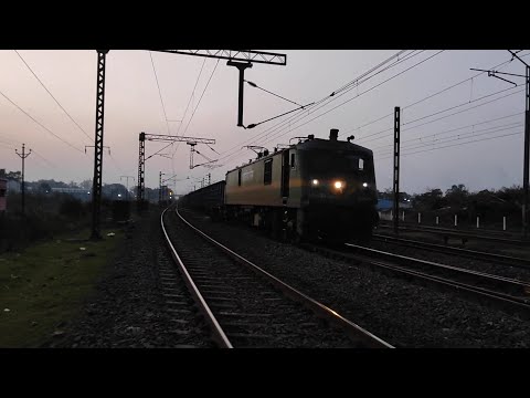 Freight Train crossing evningh Night vision freight train cross on track Indian railways.