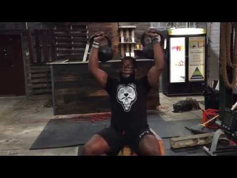 Seated Kettlebell Press; 1RM (70lbs Each Hand)