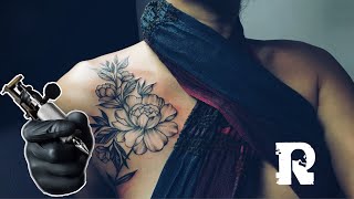 Flower tattoo on her shoulder to side rib