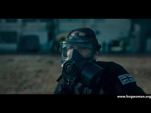 A female bomb squad leader with gas mask in several scenes